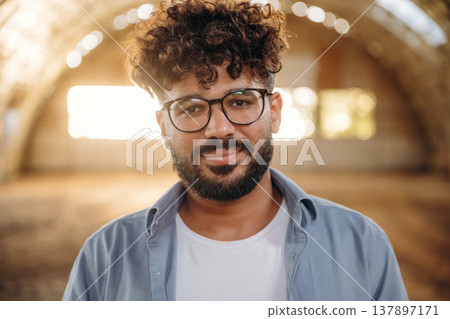Cheerful man in glasses is in hangar Cheerful man in glasses is in hangar 137897171