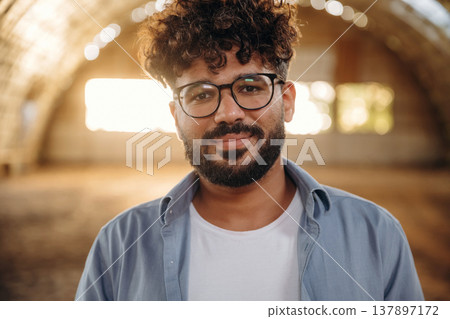Cheerful man in glasses is in hangar Cheerful man in glasses is in hangar 137897172