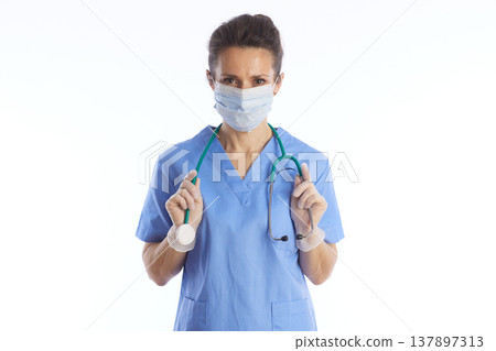 Female Surgeon in Scrubs and Gloves Ready for Examination Female Surgeon in Scrubs and Gloves Ready for Examination 137897313