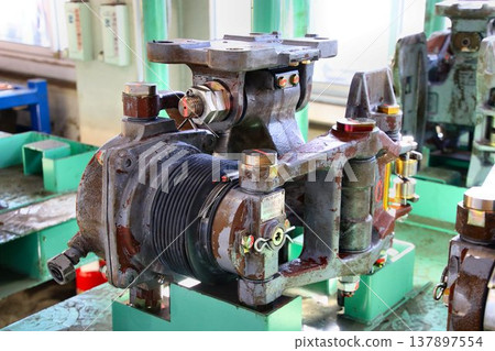 A railway vehicle disc brake unit being disassembled and serviced during a general inspection. A railway vehicle disc brake unit being disassembled and serviced during a general inspection. 137897554