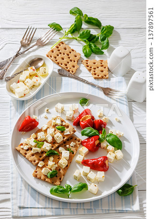 Rye crispbread open sandwich with feta and peppers Rye crispbread open sandwich with feta and peppers 137897561