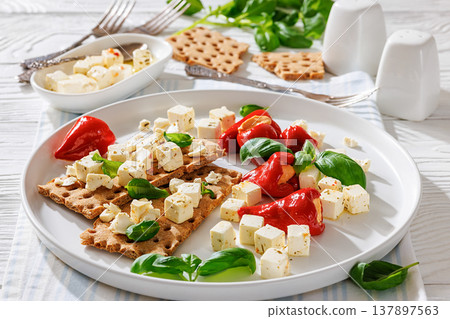 Rye crispbread open sandwich with feta and peppers Rye crispbread open sandwich with feta and peppers 137897563