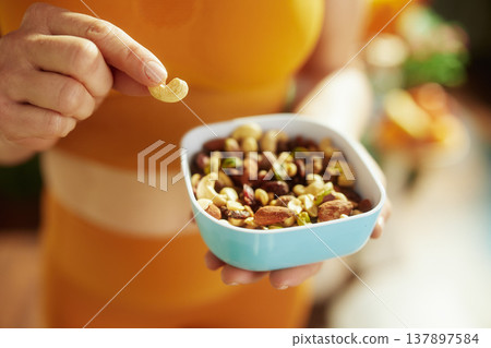 Picking a Nut from a Healthy Trail Mix Bowl 137897584