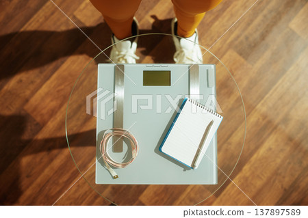 High Angle View of Weight Monitoring and Fitness Planning High Angle View of Weight Monitoring and Fitness Planning 137897589