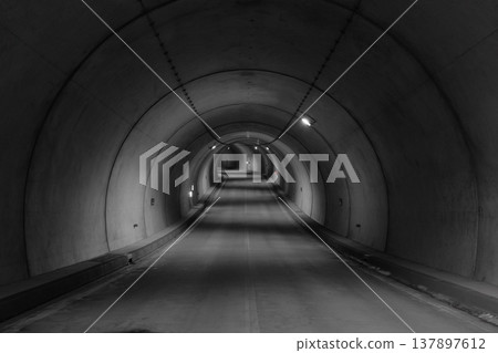 The curved, unmanned tunnel and the depth of its lighting The curved, unmanned tunnel and the depth of its lighting 137897612