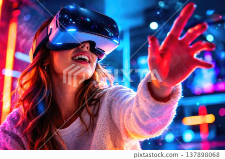 Excited woman experiencing virtual reality with VR headset in colorful neon environment Excited woman experiencing virtual reality with VR headset in colorful neon environment 137898068