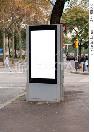 Blank white billboard screen standing in a city street promoting outdoor advertising, providing prime space for marketing mockup and commercial messaging in an urban setting Blank white billboard screen standing in a city street promoting outdoor advertising, providing prime space for marketing mockup and commercial messaging in an urban setting 137898628