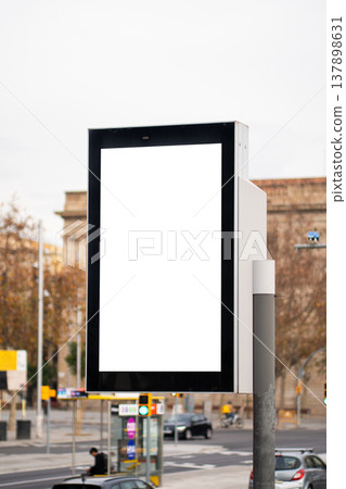 Blank vertical digital street screen with white copy space in an urban outdoor setting, ideal for advertising, signage mockups, transit promotions, and modern city campaigns Blank vertical digital street screen with white copy space in an urban outdoor setting, ideal for advertising, signage mockups, transit promotions, and modern city campaigns 137898631