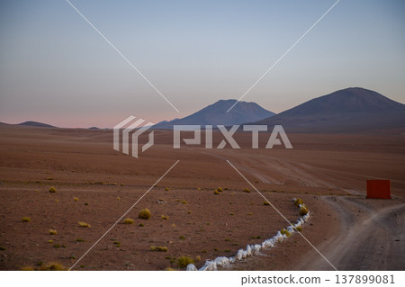 Serene desert road landscape with mountain view at twilight in Bolivia 137899081