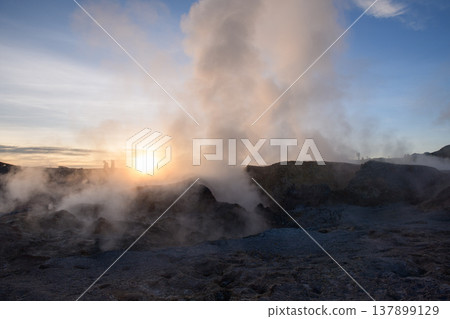 Powerful geyser erupting steam at sunrise in Sol de Manana Bolivia Powerful geyser erupting steam at sunrise in Sol de Manana Bolivia 137899129