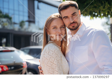 Looking forward, standing and posing. Happy couple together outdoors 137899297