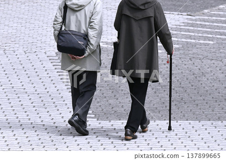 Yokohama, Japan: Urban landscapes synchronized in aging society... Two people together... Elderly woman with a cane... = Yokohama city Yokohama, Japan: Urban landscapes synchronized in aging society... Two people together... Elderly woman with a cane... = Yokohama city 137899665