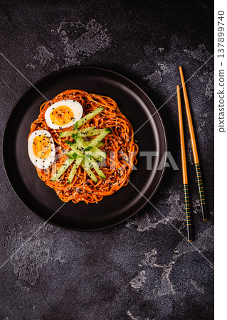 Korean traditional food, cucumber and boiled egg cold spicy noodles. 137899740