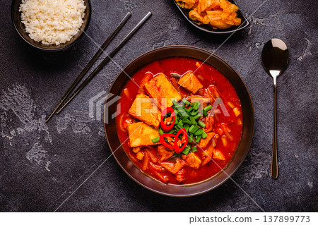 Korean traditional food, spicy kimchi soup (kimchi tige) with pork and tofu cheese. Korean traditional food, spicy kimchi soup (kimchi tige) with pork and tofu cheese. 137899773