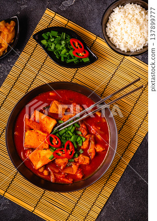 Korean traditional food, spicy kimchi soup (kimchi tige) with pork and tofu cheese. 137899777