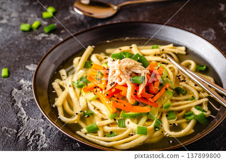 Traditional Korean chicken soup with homemade noodles 137899800