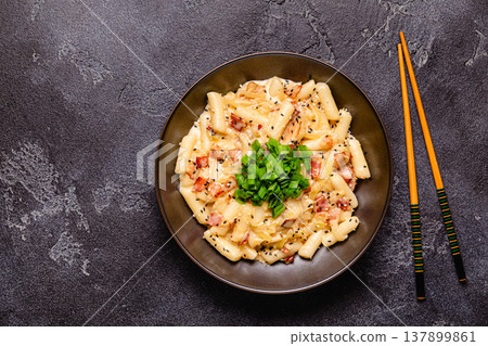 Spicy Rice Cake with Cheese and Bacon or Cream Teokbokki, Tteokbokki. 137899861