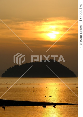 A sunset view of Lake Biwa and Chikubu Island. A sunset view of Lake Biwa and Chikubu Island. 137900170