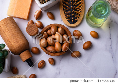 Moroccan argan seeds and oil for hair care Moroccan argan seeds and oil for hair care 137900530