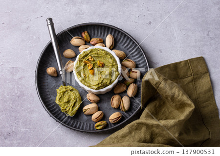 Sweet pistachio cream in a bowl Sweet pistachio cream in a bowl 137900531