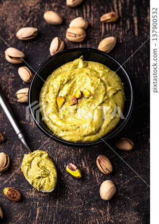 Sweet pistachio cream in a bowl Sweet pistachio cream in a bowl 137900532