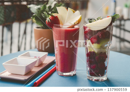 Strawbery smooties in the glass on the table 137900559