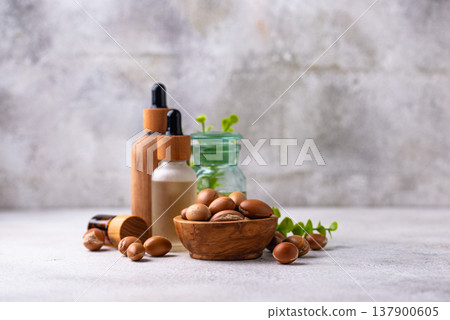 Moroccan argan seeds and oil for hair care Moroccan argan seeds and oil for hair care 137900605