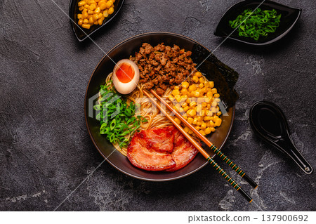 A bowl of ramen with noodles, meat and green onions. A bowl of ramen with noodles, meat and green onions. 137900692