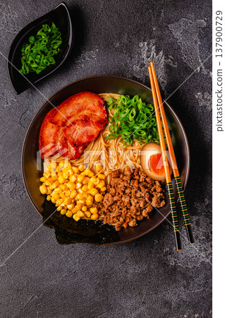 A bowl of ramen with noodles, meat and green onions. A bowl of ramen with noodles, meat and green onions. 137900729
