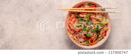 Bowl of rice noodles with vegan soy meat and vegetables. Bowl of rice noodles with vegan soy meat and vegetables. 137900747