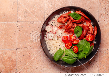 Bowl with vegan fried soy meat and vegetables served with boiled rice. Bowl with vegan fried soy meat and vegetables served with boiled rice. 137900750