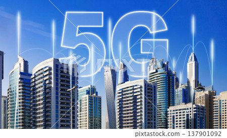 City skyline shows the rise of 5G internet with tall buildings under a clear blue sky City skyline shows the rise of 5G internet with tall buildings under a clear blue sky 137901092