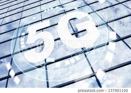 5G internet technology shows on a modern building with reflective glass windows 137901108