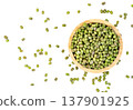 Top view of organic green mung beans in a small wooden bowl. Raw legumes scattered around, perfect for healthy diet, vegetarian cooking, and superfood concepts. 137901925