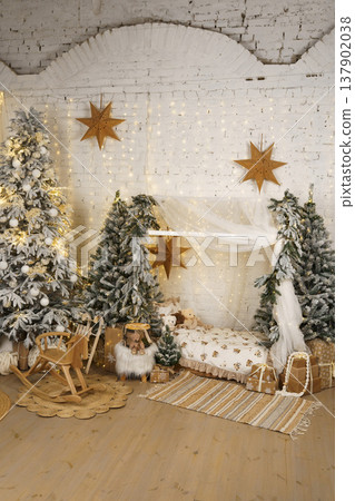 Minimal Christmas kids room with snow covered trees, fairy lights and gifts Minimal Christmas kids room with snow covered trees, fairy lights and gifts 137902038