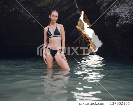 Young woman enjoying serene evening at sea in Krabi, Thailand Young woman enjoying serene evening at sea in Krabi, Thailand 137902105
