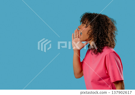 Attention, Portrait Of Young Woman Shouting, Holding Hand Near Open Mouth Attention, Portrait Of Young Woman Shouting, Holding Hand Near Open Mouth 137902617