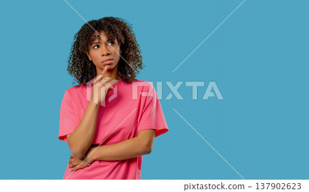 Thoughtful Around African Teen school student girl, Weighing Options, dreaming about future. Puzzled Lady Looking Answer 137902623