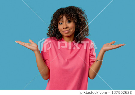 Confused African Teen Girl Shrugs Shoulders. Uncertainty, Confusion,Hesitation Confused African Teen Girl Shrugs Shoulders. Uncertainty, Confusion,Hesitation 137902628