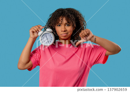 Woken Up By Alarm Clock Sleepy Young African Woman. blue Background, Laziness 137902659