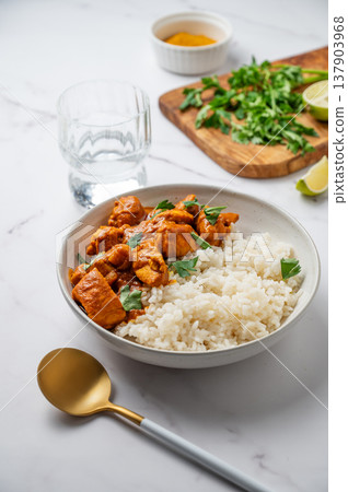 Chicken tikka masala curry with rice on marble background Chicken tikka masala curry with rice on marble background 137903968