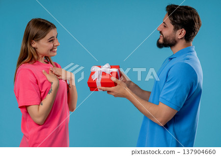 Young man Gives Gift Box To Wife Or Girlfriend. Surprise, Unexpected Present 137904660