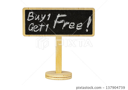 Retail Promotion Buy One Get One Free Offer Handwritten in White Chalk on a Small Wooden Blackboard Sign Isolated on White Background with Copy Space for Text 137904739