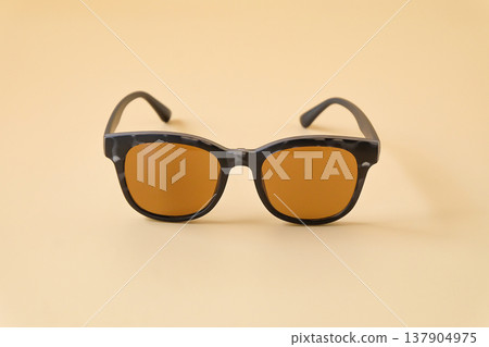 sunglasses in black frame on color background. sunglasses in black frame on color background. 137904975