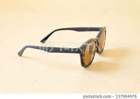 sunglasses in black frame on color background. sunglasses in black frame on color background. 137904976
