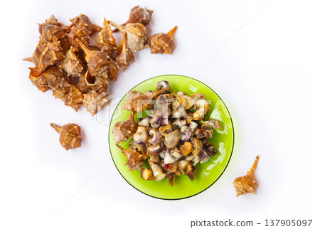 Fresh Seafood on a Green Plate With Empty Shells Arranged Nearby in a Kitchen Setting During Daylight Hours Fresh Seafood on a Green Plate With Empty Shells Arranged Nearby in a Kitchen Setting During Daylight Hours 137905097