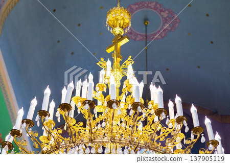 ceiling in the church with the illuminator. church lamp look from below ceiling in the church with the illuminator. church lamp look from below 137905119