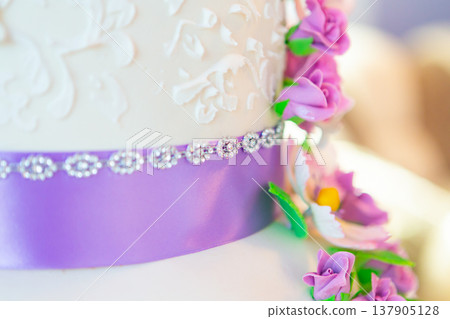 wedding cake decoration. beautiful wedding cake with purple orchids. cake in violet tones 137905128