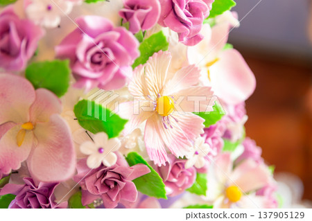 wedding cake decoration. beautiful wedding cake with purple orchids. cake in violet tones wedding cake decoration. beautiful wedding cake with purple orchids. cake in violet tones 137905129