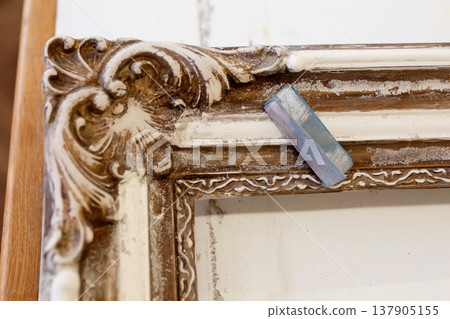 Wooden Frame With Intricate Design Displayed on a Table in a Studio During Daylight Wooden Frame With Intricate Design Displayed on a Table in a Studio During Daylight 137905155